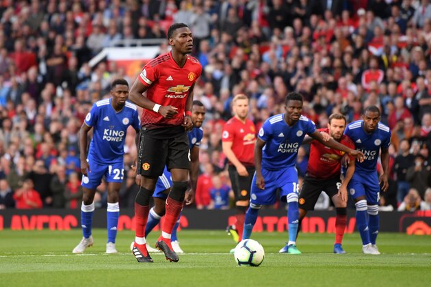 MANCHESTER, ENGLAND - AUGUST 10:  Paul Pogba of Manchester United scores his team's first goal from the penalty spot during the Premier League match between Manchester United and Leicester City at Old Trafford on August 10, 2018 in Manchester, United Kingdom.  (Photo by Laurence Griffiths/Getty Images)