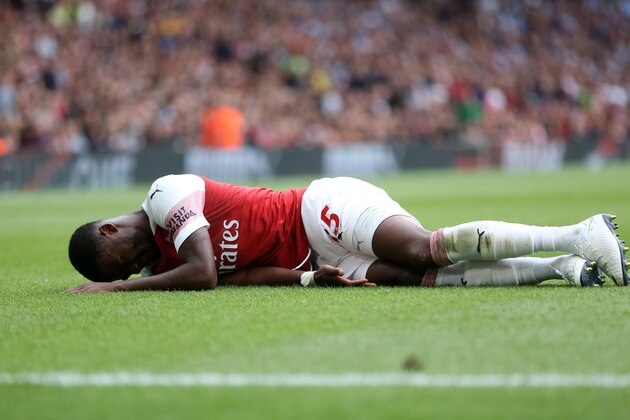 LONDON, ENGLAND - AUGUST 12: An injured Ainsley Maitland-Niles of Arsenal during the Premier League match between Arsenal FC and Manchester City at Emirates Stadium on August 12, 2018 in London, United Kingdom. (Photo by James Baylis - AMA/Getty Images)