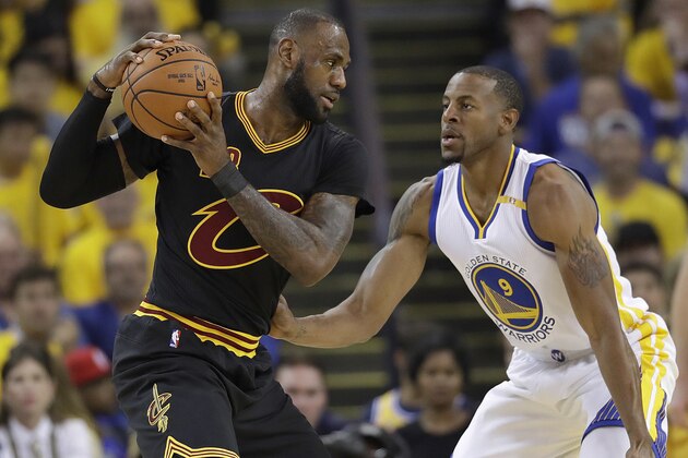 Cleveland Cavaliers forward LeBron James (23) is guarded by Golden State Warriors forward Andre Iguodala (9) during the first half of Game 5 of basketball's NBA Finals in Oakland, Calif., Monday, June 12, 2017. (AP Photo/Marcio Jose Sanchez)