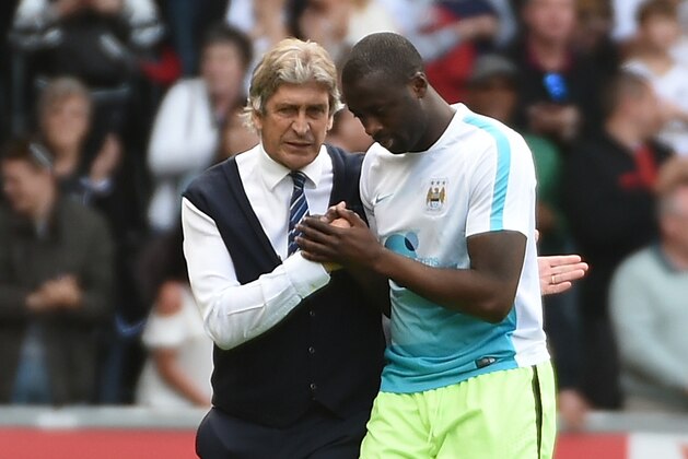 SWANSEA, WALES - MAY 15:  Manuel Pellegrini, manager of Manchester City and Yaya Toure shake hands after the Barclays Premier League match between Swansea City and Manchester City at the Liberty Stadium on May 15, 2016 in Swansea, Wales.  (Photo by Tom Dulat/Getty Images)