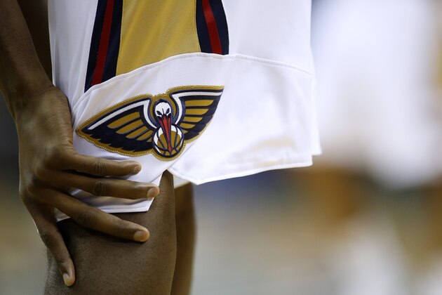 The New Orleans Pelicans' logo is seen during the second half of an NBA basketball game in New Orleans, Wednesday, Feb. 19, 2014. The Knicks won 98-91. (AP Photo/Jonathan Bachman)