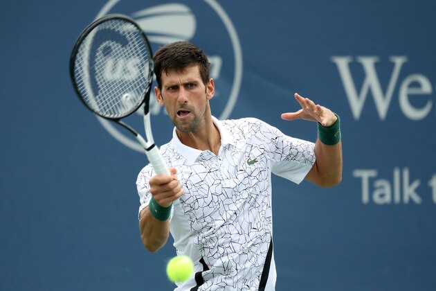 MASON, OH - AUGUST 15: Novak Djokovic of Serbia returns a shot against Adrian Mannarino of France during Day 5 of the Western and Southern Open at the Lindner Family Tennis Center on August 15, 2018 in Mason, Ohio. (Photo by Rob Carr/Getty Images)