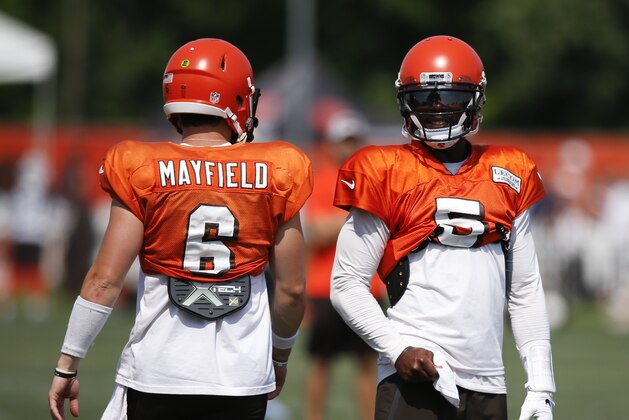 Cleveland Browns quarterback Tyrod Taylor (5) talks with Baker Mayfield (6) during NFL football training camp Tuesday, Aug. 14, 2018, in Berea, Ohio. (AP Photo/Ron Schwane)
