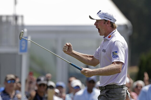 Brandt Snedeker reacts after making a birdie putt on the ninth hole during the first round of the Wyndham Championship golf tournament in Greensboro, N.C., Thursday, Aug. 16, 2018. Sneaker shot a 59 in the first round. (AP Photo/Chuck Burton)