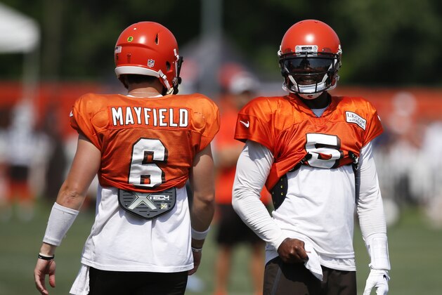 Cleveland Browns quarterback Tyrod Taylor (5) talks with Baker Mayfield (6) during NFL football training camp Tuesday, Aug. 14, 2018, in Berea, Ohio. (AP Photo/Ron Schwane) Cleveland Browns quarterback Tyrod Taylor (5) talks with Baker Mayfield (6) during NFL football training camp Tuesday, Aug. 14, 2018, in Berea, Ohio. (AP Photo/Ron Schwane)