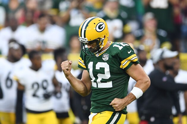 GREEN BAY, WI - AUGUST 16:  Aaron Rodgers #12 of the Green Bay Packers celebrates a touchdown pass during the first quarter of a preseason game against the Pittsburgh Steelers at Lambeau Field on August 16, 2018 in Green Bay, Wisconsin.  (Photo by Stacy Revere/Getty Images)