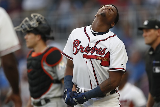 Atlanta Braves left fielder Ronald Acuna Jr. (13) reacts after being hit by a pitch from Miami Marlins starting pitcher Jose Urena in the first inning of a baseball game Wednesday, Aug. 15, 2018, in Atlanta. (AP Photo/John Bazemore)