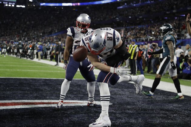 New England Patriots tight end Rob Gronkowski (87) spikes the ball as he celebrates a touchdown reception, during the second half of the NFL Super Bowl 52 football game against the Philadelphia Eagles,Sunday, Feb. 4, 2018, in Minneapolis. (AP Photo/Chris O'Meara)