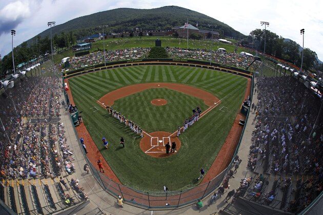 The Little League team from Des Moines, Iowa lines the third baseline as the Staten Island team is introduced in Lamade Stadium before a baseball game in United States pool play at the Little League World Series tournament in South Williamsport, Pa., Thursday, Aug. 16, 2018. (AP Photo/Gene J. Puskar)
