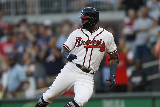 Atlanta Braves left fielder Ronald Acuna Jr. (13) rounds first base after a single in the first inning of a baseball game against the Colorado Rockies Thursday, Aug. 16, 2018, in Atlanta. (AP Photo/John Bazemore)