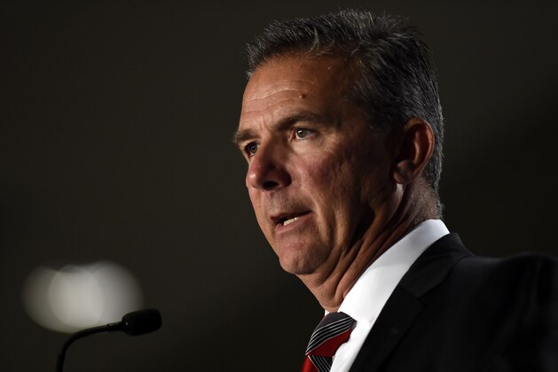 File-This July 24, 2018, file photo shows Ohio State head coach Urban Meyer speaking at the Big Ten Conference NCAA college football Media Days in Chicago. The Big Ten East has been called the toughest division in college football, and that’s expected to be the case again this season even with the uncertainty surrounding Meyer and his defending conference champion Ohio State Buckeyes.  (AP Photo/Annie Rice, File)