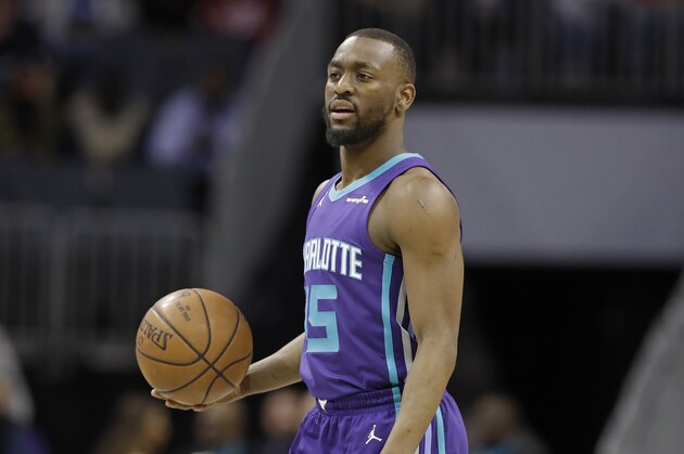 Charlotte Hornets' Kemba Walker (15) brings the ball up the court against the Indiana Pacers during the first half of an NBA basketball game in Charlotte, N.C., Sunday, April 8, 2018. (AP Photo/Chuck Burton)