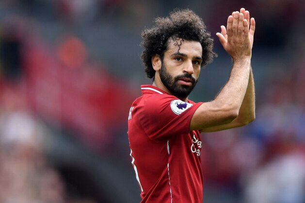 LIVERPOOL, ENGLAND - AUGUST 12:  Mohamed Salah of Liverpool applauds fans during the Premier League match between Liverpool FC and West Ham United at Anfield on August 12, 2018 in Liverpool, United Kingdom.  (Photo by Laurence Griffiths/Getty Images)