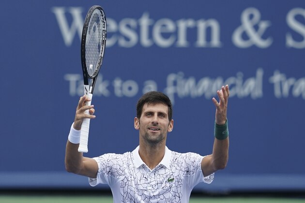 Novak Djokovic, of Serbia, celebrates after winning his match against Grigor Dimitrov, of Bulgaria, at the Western & Southern Open tennis tournament, Friday, Aug. 17, 2018, in Mason, Ohio. (AP Photo/John Minchillo)