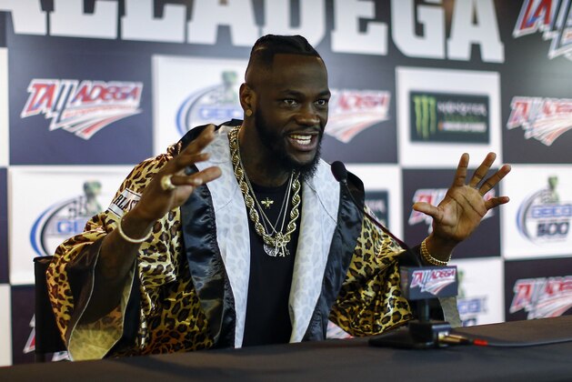 WBC Heavyweight Champion Deontay Wilder speaks at a press conference before the GEICO 500 NASCAR Talladega auto race at Talladega Superspeedway, Sunday, April 29, 2018, in Talladega, Ala. (AP Photo/Butch Dill)