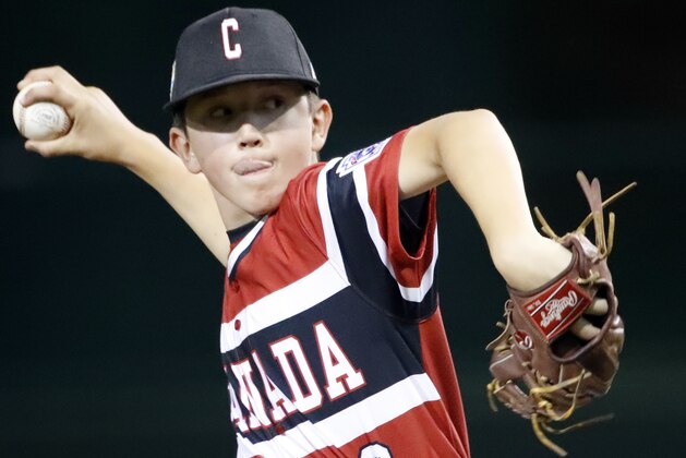 Canada's Cole Balkovec delivers a pitch against Panama during the fifth inning of an International pool play baseball game at the Little League World Series tournament in South Williamsport, Pa., Friday, Aug. 17, 2018. (AP Photo/Tom E. Puskar)