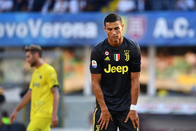 Juventus' Portuguese forward, Cristiano Ronaldo reacts during the Italian Serie A football match AC Chievo vs Juventus at the Marcantonio-Bentegodi stadium in Verona on August 18, 2018. (Photo by Alberto PIZZOLI / AFP)        (Photo credit should read ALBERTO PIZZOLI/AFP/Getty Images)