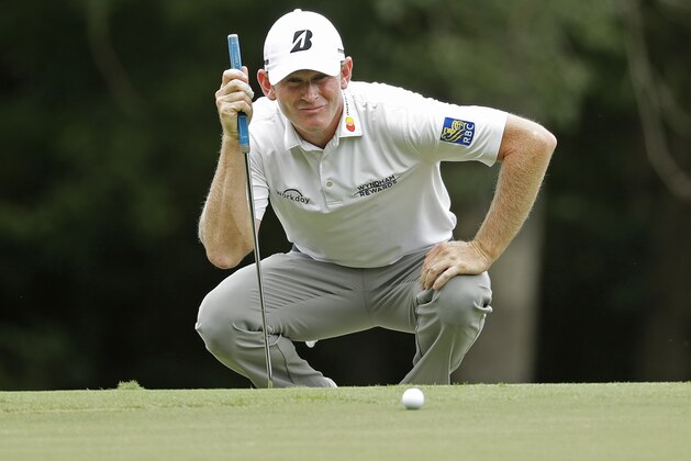 Brandt Snedeker lines up a putt on the first hole during the third round of the Wyndham Championship golf tournament at Sedgefield Country Club in Greensboro, N.C., Saturday, Aug. 18, 2018. (AP Photo/Chuck Burton)