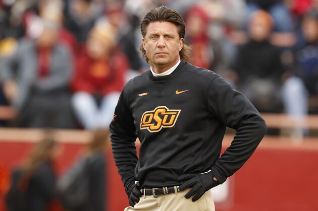 AMES, IA - NOVEMBER 11: Head coach Mike Gundy of the Oklahoma State Cowboys coaches during warm ups before game action against the Iowa State Cyclones at Jack Trice Stadium on November 11, 2017 in Ames, Iowa. The Oklahoma State Cowboys won 49-42 over the Iowa State Cyclones. (Photo by David K Purdy/Getty Images)