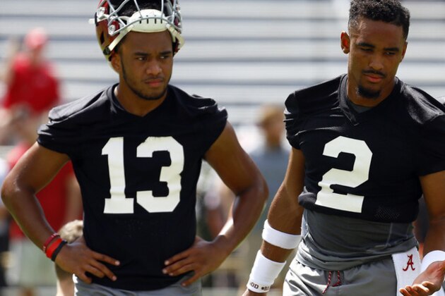 Alabama quarterback Jalen Hurts (2) and quarterback Tua Tagovailoa (13) runs drills during a NCAA college football practice, Saturday, Aug. 4, 2018, in Tuscaloosa, Ala. (AP Photo/Butch Dill)