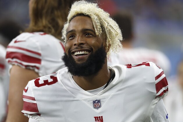 New York Giants wide receiver Odell Beckham smiles on the sidelines during the first half of an NFL football game against the Detroit Lions, Friday, Aug. 17, 2018, in Detroit. (AP Photo/Paul Sancya)