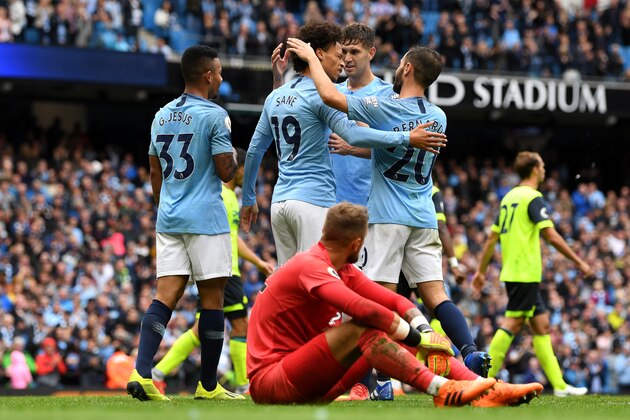 MANCHESTER, ENGLAND - AUGUST 19:  Ben Hamer of Huddersfield Town looks on as Leroy Sane of Manchester City celebrates with teammates after his shot leads to an own goal from Terence Kongolo of Huddersfield Town, Manchester City's sixth goal during the Premier League match between Manchester City and Huddersfield Town at Etihad Stadium on August 19, 2018 in Manchester, United Kingdom.  (Photo by Michael Regan/Getty Images)