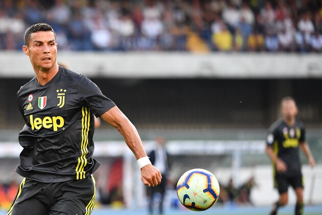 Juventus' Portuguese forward, Cristiano Ronaldo eyes the ball during the Italian Serie A football match AC Chievo vs Juventus at the Marcantonio-Bentegodi stadium in Verona on August 18, 2018. (Photo by Alberto PIZZOLI / AFP)        (Photo credit should read ALBERTO PIZZOLI/AFP/Getty Images)