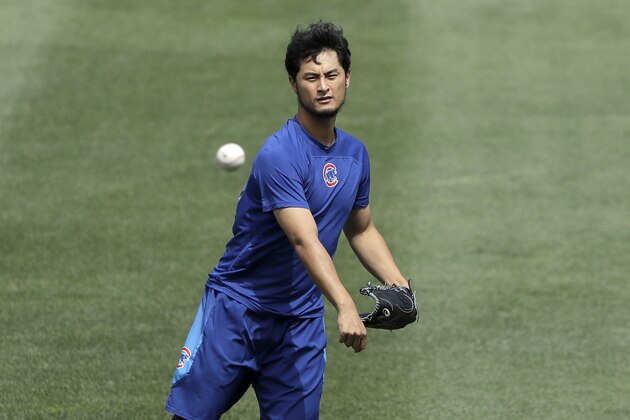Chicago Cubs' Yu Darvish works out in left field before a baseball game between the Cubs and the St. Louis Cardinals Thursday, July 19, 2018, in Chicago. (AP Photo/Charles Rex Arbogast)