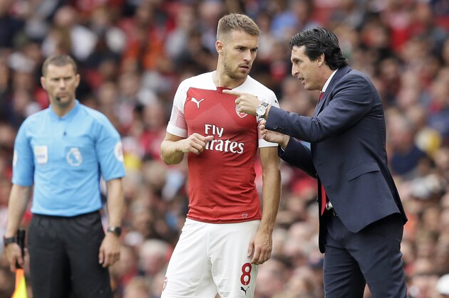 Arsenal manager Unai Emery gives instructions to Arsenal's Aaron Ramsey during the English Premier League soccer match between Arsenal and Manchester City at the Emirates stadium in London, England, Sunday, Aug. 12, 2018. (AP Photo/Tim Ireland)