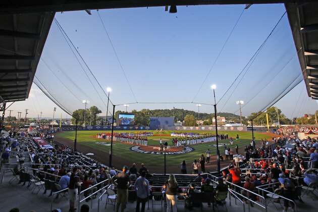 The Pittsburgh Pirates and St. Louis Cardinals line the baselines, and the 16 Little League teams from around the world participating in the Little League World Series line the infield before the Little League Classic baseball game between the Pirates and the Cardinals at Bowman Field in Williamsport, Pa., Sunday, Aug. 20, 2017. (AP Photo/Gene J. Puskar)