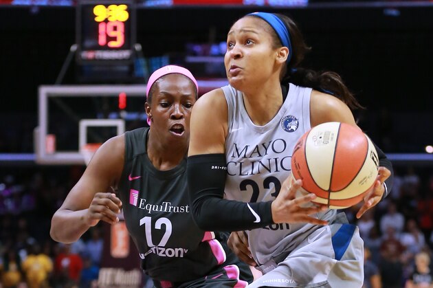 LOS ANGELES, CA - AUGUST 02:  Maya Moore #23 of the Minnesota Lynx handles the ball against Chelsea Gray #12 of the Los Angeles Sparks during a WNBA basketball game at Staples Center on August 2, 2018 in Los Angeles, California.  (Photo by Leon Bennett/Getty Images)