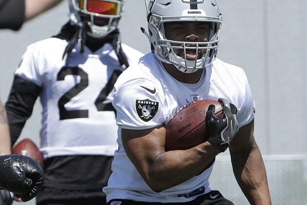 Oakland Raiders running back Doug Martin practices at the team's NFL football training facility in Alameda, Calif., Tuesday, May 29, 2018. (AP Photo/Jeff Chiu)