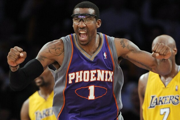 FILE - This May 27, 2010, file photo shows Phoenix Suns forward Amare Stoudemire reacting after a dunk during the second half of Game 5 of the NBA basketball Western Conference finals against the Los Angeles Lakers, in Los Angeles. Free agent Amare Stoudemire visits with the New York Knicks, who could be working toward a deal that would reunite the All-Star forward with Mike D'Antoni, his former coach in Phoenix.  (AP Photo/Mark J. Terrill, File)