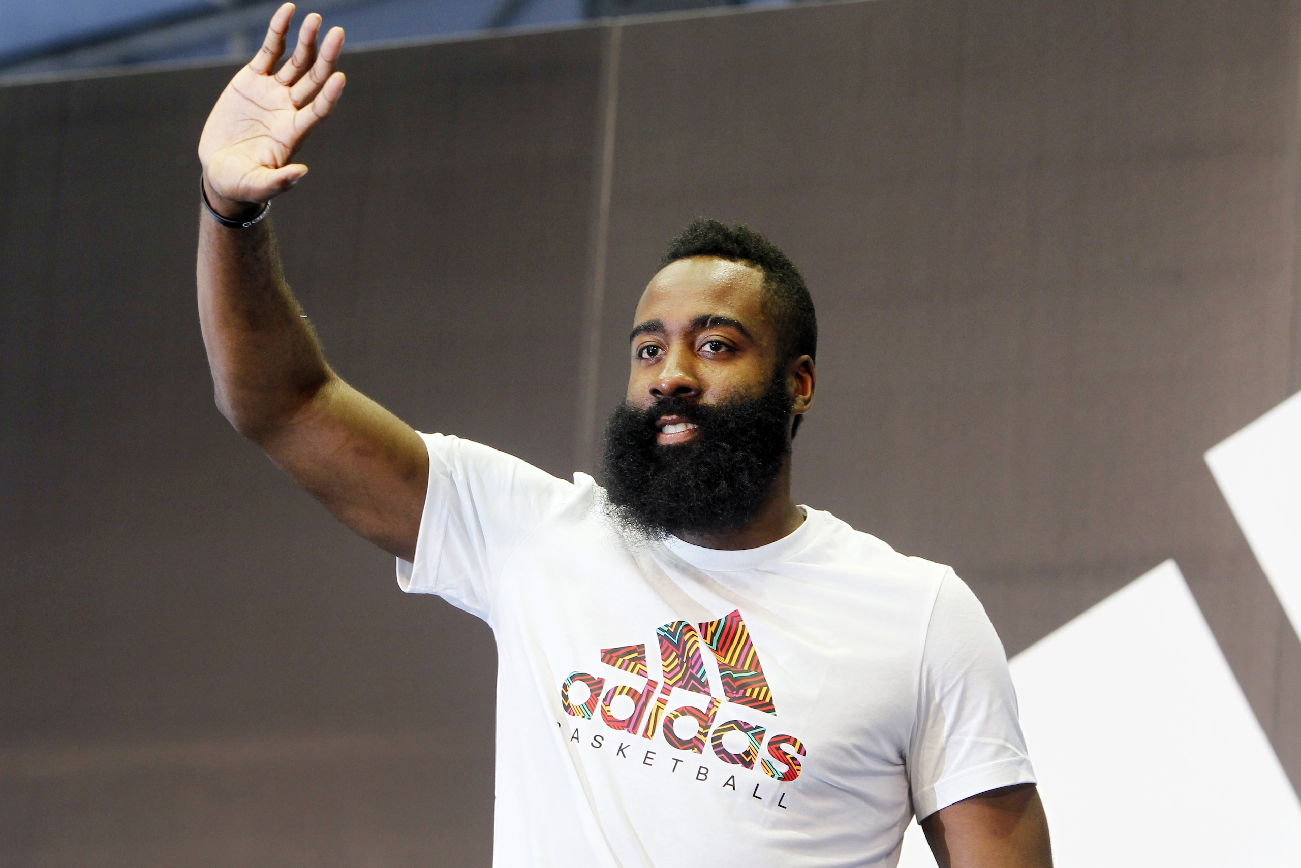 NBA Houston Rockets guard James Harden waves to fans during a media event in Taipei, Taiwan, Wednesday, July 4, 2018.(AP Photo/Chiang Ying-ying)