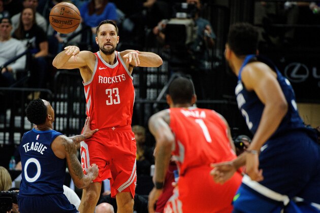 MINNEAPOLIS, MN - APRIL 21: Ryan Anderson #33 of the Houston Rockets passes the ball to teammate Trevor Ariza #1 and away from Jeff Teague #0 of the Minnesota Timberwolves in Game Three of Round One of the 2018 NBA Playoffs on April 21, 2018 at the Target Center in Minneapolis, Minnesota. The Timberwolves defeated 121-105. NOTE TO USER: User expressly acknowledges and agrees that, by downloading and or using this Photograph, user is consenting to the terms and conditions of the Getty Images License Agreement. (Photo by Hannah Foslien/Getty Images)
