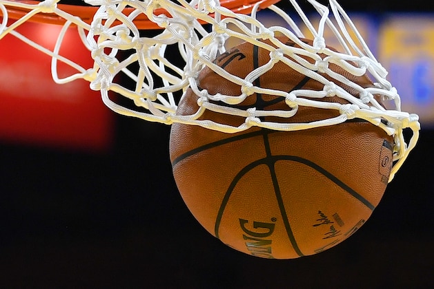 OAKLAND, CA - APRIL 14:  A detailed view of a Spalding NBA basketball going through the net while players warm up prior to the start of Game One of the first round of the 2018 NBA Playoff between the San Antonio Spurs and Golden State Warriors at ORACLE Arena on April 14, 2018 in Oakland, California. NOTE TO USER: User expressly acknowledges and agrees that, by downloading and or using this photograph, User is consenting to the terms and conditions of the Getty Images License Agreement.  (Photo by Thearon W. Henderson/Getty Images)