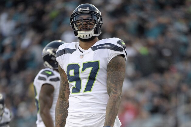 Seattle Seahawks defensive end Marcus Smith (97) sets up for a play during the first half of an NFL football game against the Jacksonville Jaguars Sunday, Dec. 10, 2017, in Jacksonville, Fla. (AP Photo/Phelan M. Ebenhack)