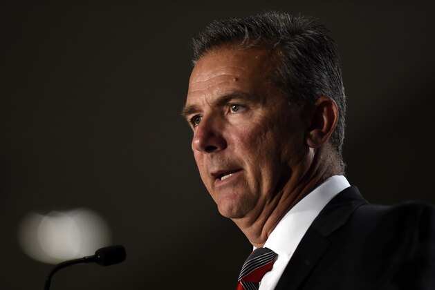 File-This July 24, 2018, file photo shows Ohio State head coach Urban Meyer speaking at the Big Ten Conference NCAA college football Media Days in Chicago. The Big Ten East has been called the toughest division in college football, and that’s expected to be the case again this season even with the uncertainty surrounding Meyer and his defending conference champion Ohio State Buckeyes.  (AP Photo/Annie Rice, File)