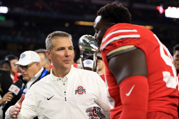 ARLINGTON, TX - DECEMBER 29:  Head coach Urban Meyer shakes hands with Isaiah Prince #59 of the Ohio State Buckeyes after winning the Goodyear Cotton Bowl against the USC Trojans at AT&T Stadium on December 29, 2017 in Arlington, Texas.  (Photo by Ronald Martinez/Getty Images)