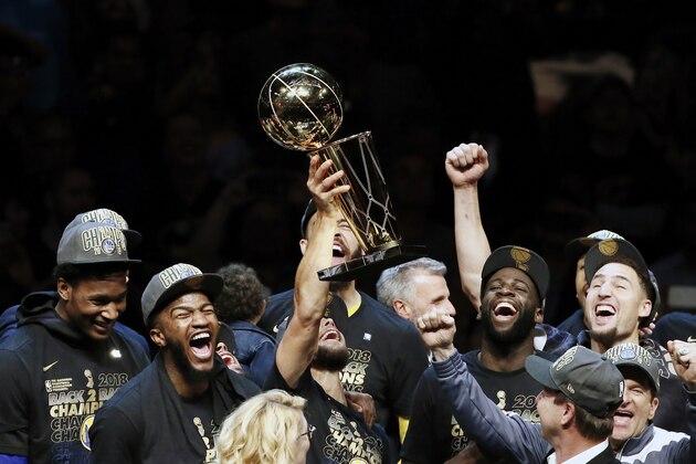 CLEVELAND, CA - JUN 8:  Stephen Curry #30 of the Golden State Warriors holds the Larry O'Brien Championship trophy after defeating the Cleveland Cavaliers in Game Four of the 2018 NBA Finals won 108-85 by the Golden State Warriors over the Cleveland Cavaliers at the Quicken Loans Arena on June 6, 2018 in Cleveland, Ohio. NOTE TO USER: User expressly acknowledges and agrees that, by downloading and or using this photograph, User is consenting to the terms and conditions of the Getty Images License Agreement. Mandatory Copyright Notice: Copyright 2018 NBAE (Photo by Chris Elise/NBAE via Getty Images)