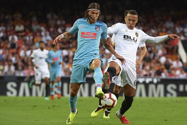 VALENCIA, SPAIN - AUGUST 20: Rodrigo Moreno of Valencia competes for the ball with Filipe Luis of Atletico de Madrid during the La Liga match between Valencia CF and Club Atletico de Madrid at Estadio Mestalla on August 20, 2018 in Valencia, Spain.  (Photo by Quality Sport Images/Getty Images)
