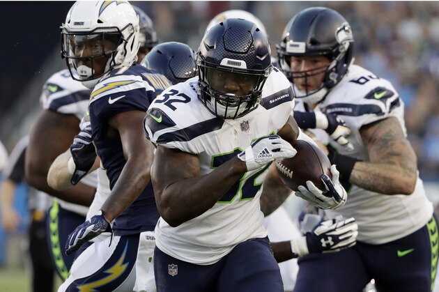 Seattle Seahawks running back Chris Carson (32) runs against the Los Angeles Chargers during the first half of an NFL preseason football game Saturday, Aug. 18, 2018, in Carson, Calif. (AP Photo/Gregory Bull)