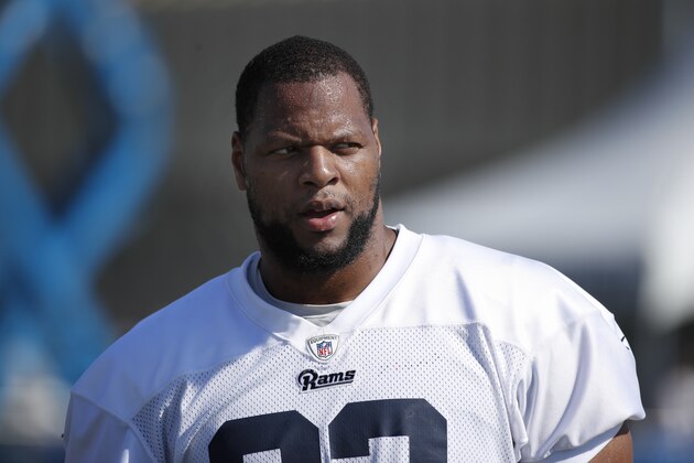 Los Angeles Rams defensive tackle Ndamukong Suh walks on the field during NFL football training camp Friday, July 27, 2018, in Irvine, Calif. (AP Photo/Jae C. Hong)