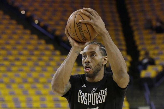 San Antonio Spurs forward Kawhi Leonard warms up before Game 1 of the NBA basketball Western Conference finals against the Golden State Warriors in Oakland, Calif., Sunday, May 14, 2017. (AP Photo/Jeff Chiu)