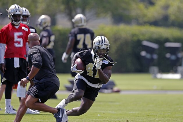 New Orleans Saints running back Alvin Kamara (41) runs through drills during an NFL football practice in Metairie, La., Thursday, June 7, 2018. (AP Photo/Gerald Herbert)