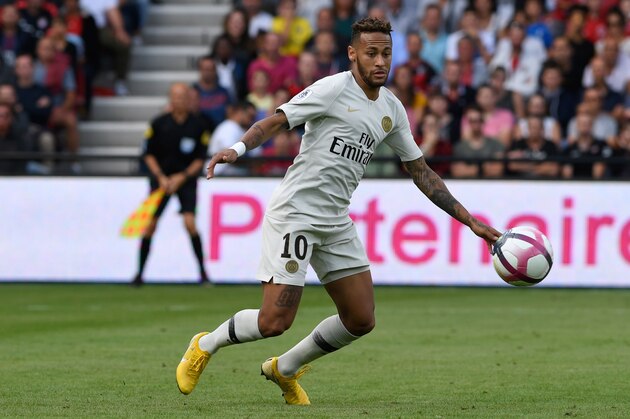 Paris Saint-Germain's Brazilian forward Neymar eyes the ball during the French L1 football match between Guingamp and Paris Saint-Germain, at the Roudourou stadium in Guingamp on August 18, 2018. (Photo by FRED TANNEAU / AFP)        (Photo credit should read FRED TANNEAU/AFP/Getty Images)
