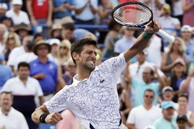 Novak Djokovic, of Serbia, reacts after defeating Roger Federer, of Switzerland, during the finals at the Western & Southern Open tennis tournament, Sunday, Aug. 19, 2018, in Mason, Ohio. (AP Photo/John Minchillo)