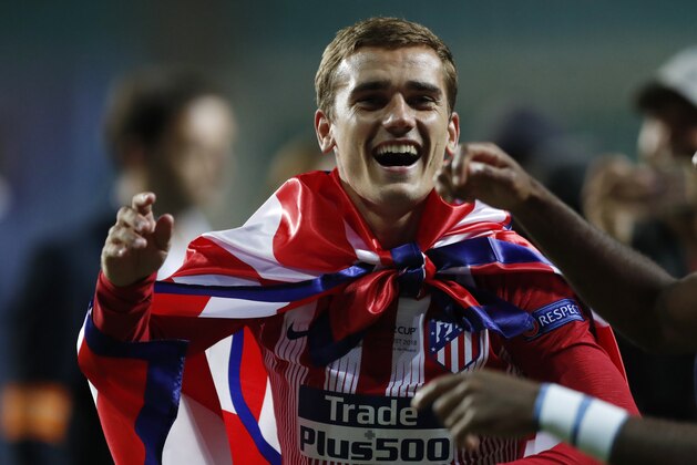Atletico's Antoine Griezmann celebrates after winning the UEFA Super Cup final soccer match between Real Madrid and Atletico Madrid at the Lillekula Stadium in Tallinn, Estonia, Wednesday, Aug. 15, 2018. (AP Photo/Pavel Golovkin)