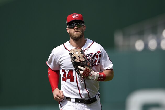 Washington Nationals' Bryce Harper runs in towards the dugout during a baseball game against the Miami Marlins, Sunday, Aug. 19, 2018, in Washington. The Marlins won 12-1. (AP Photo/Nick Wass)