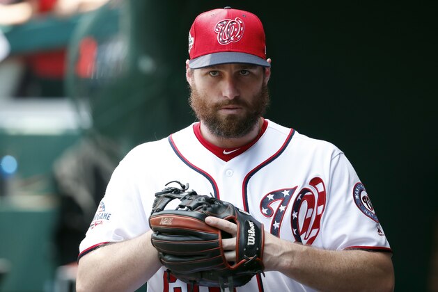 Washington Nationals second baseman Daniel Murphy (20) walks in the dugout before the first baseball game of doubleheader against the Cincinnati Reds at Nationals Park, Saturday, Aug. 4, 2018, in Washington. (AP Photo/Alex Brandon)